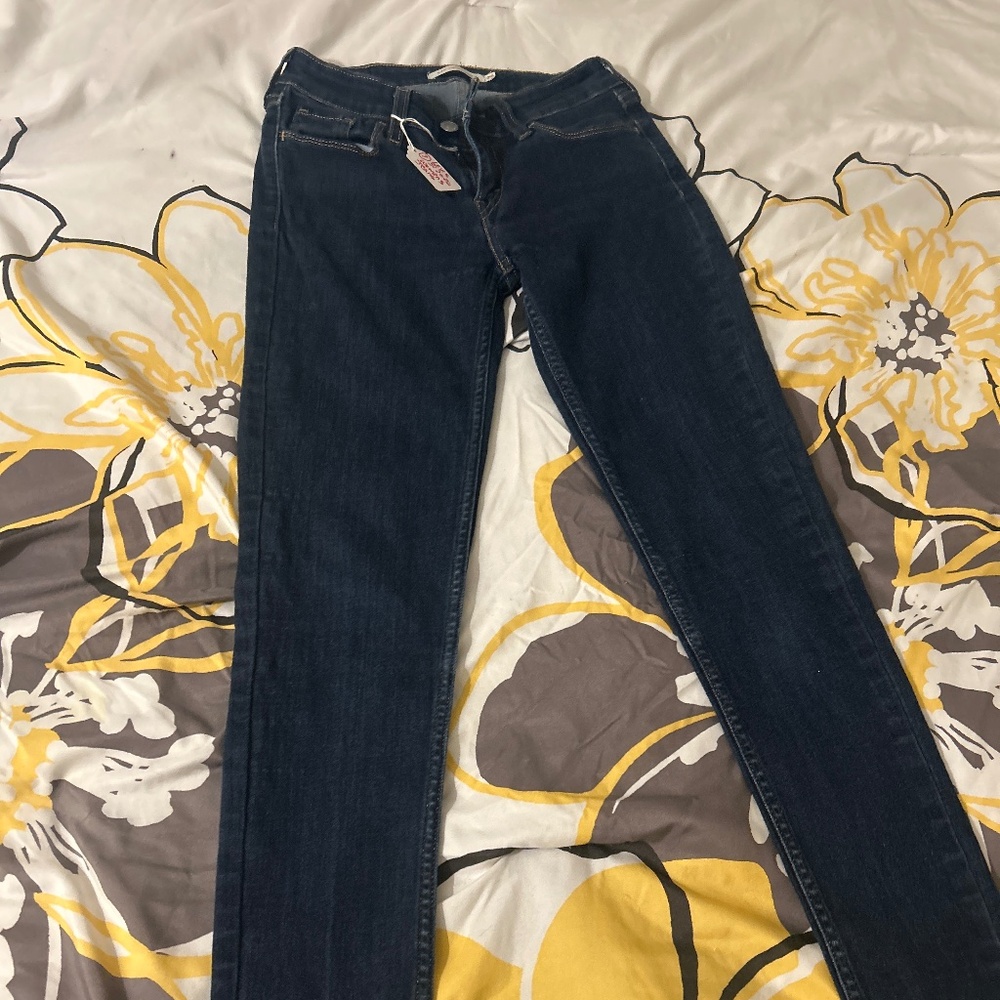 7) women’s size 26 Levi’s jeans. They are the stretchy skinny jeans. And really